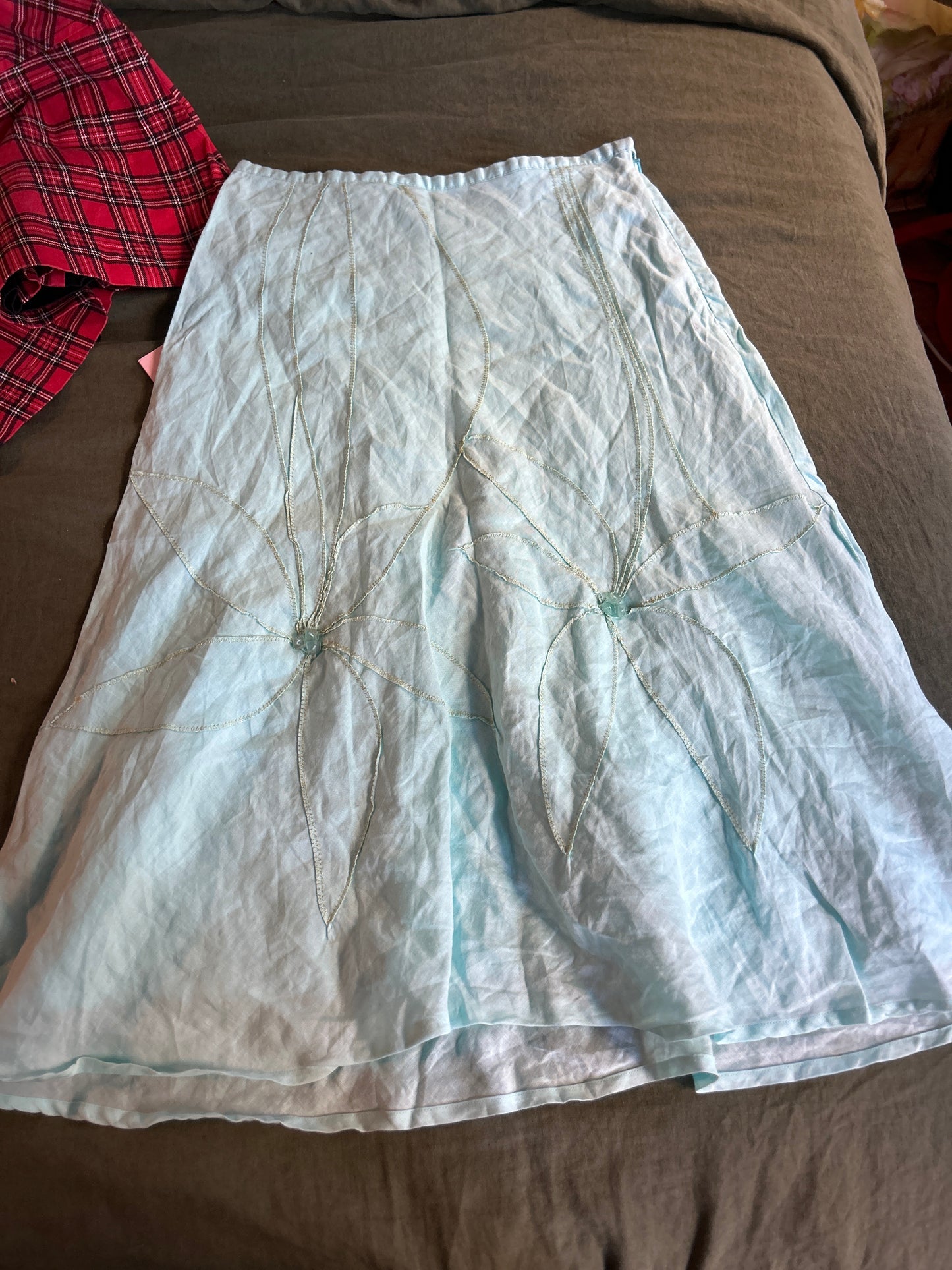Teal linen skirt with floral detail