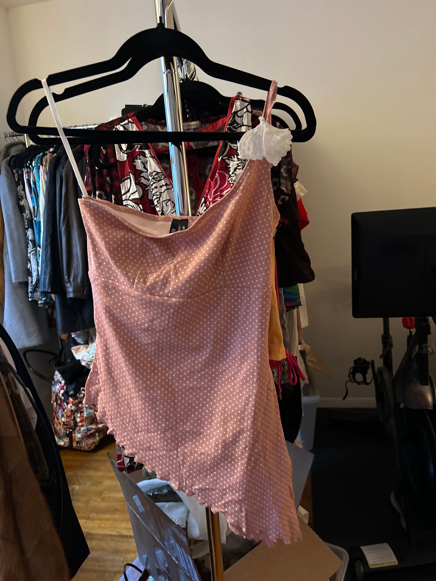 Asymmetric pink and white polkadot tank top with butterfly