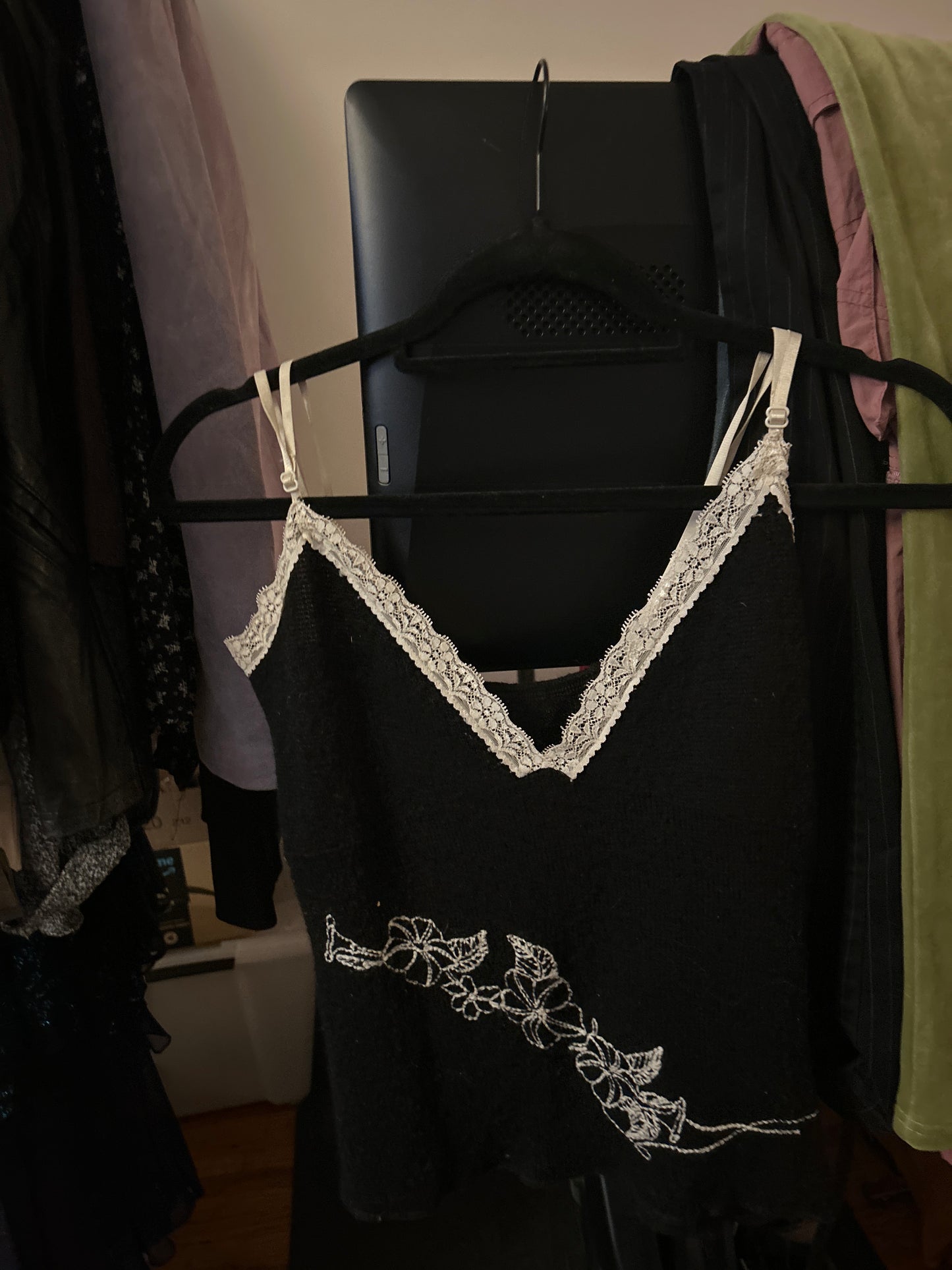 Black knit tank top with white floral embroidery