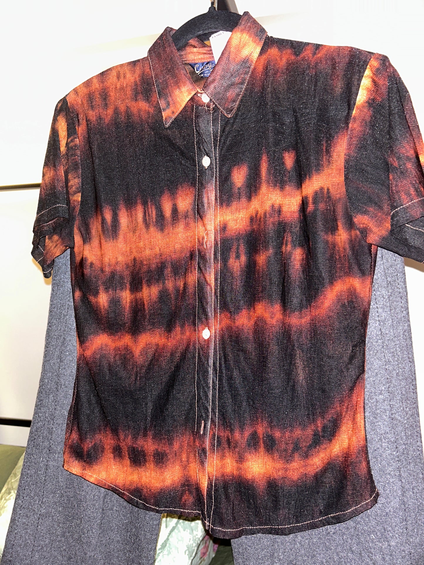 Orange and black dyed sheer top
