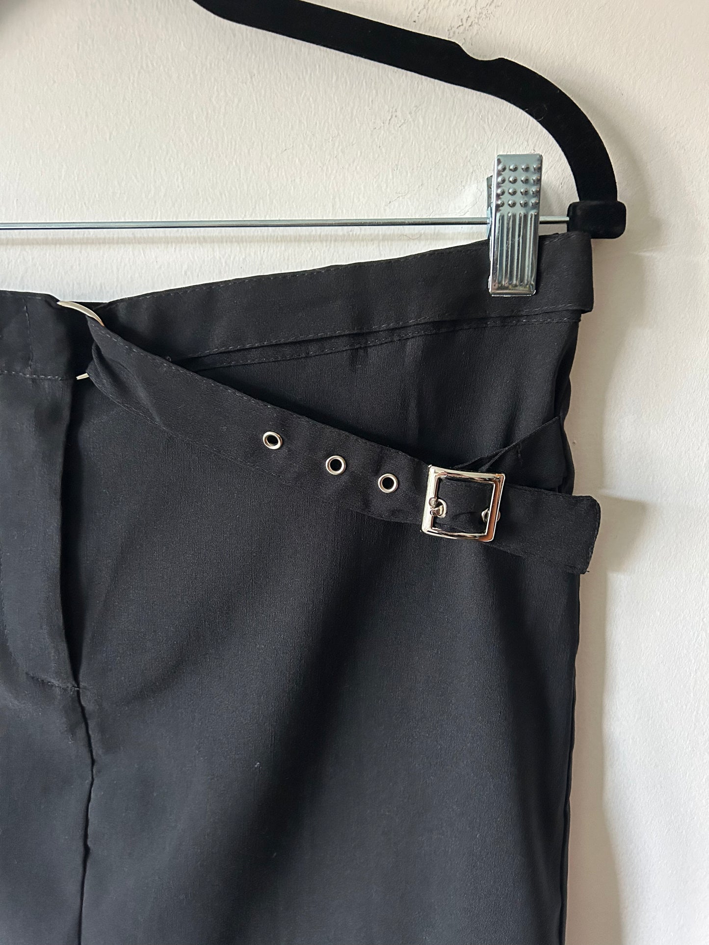 black mini skirt with buckle detail