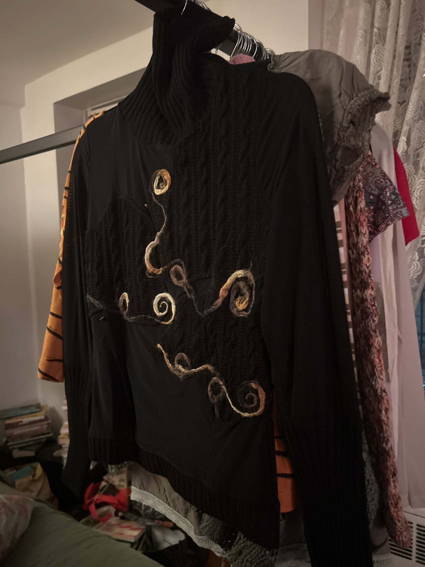 Sheer/knit sweater with swirls