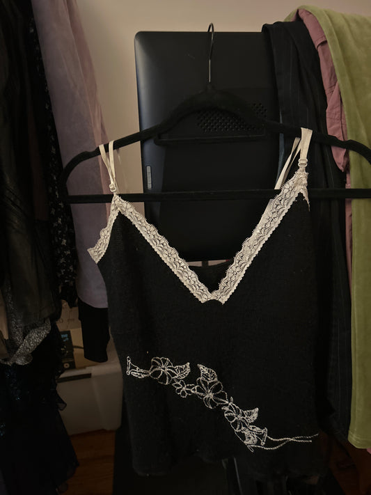 Black knit tank top with white floral embroidery