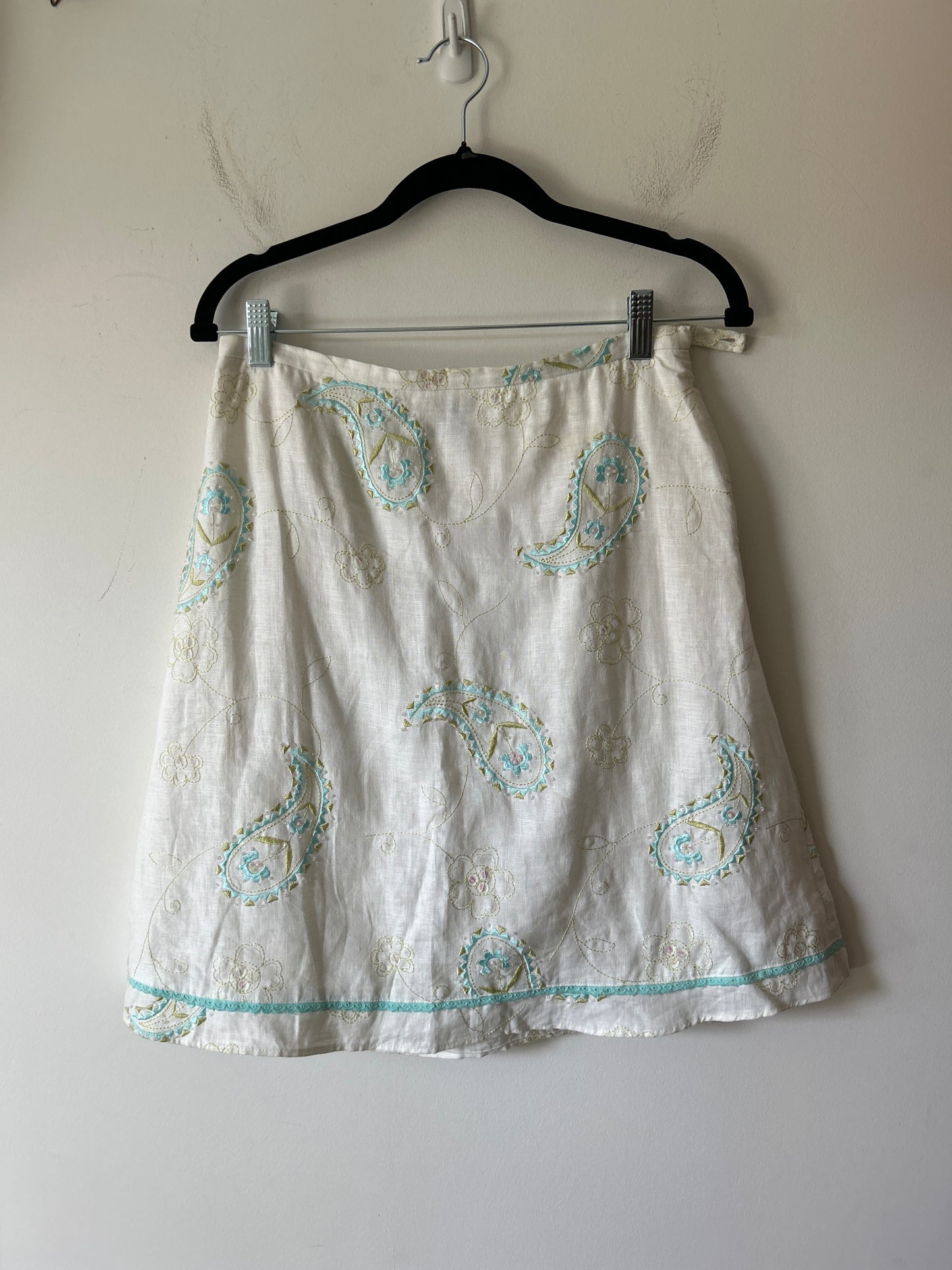 white linen midi skirt with embroidered paisley and eyelet details