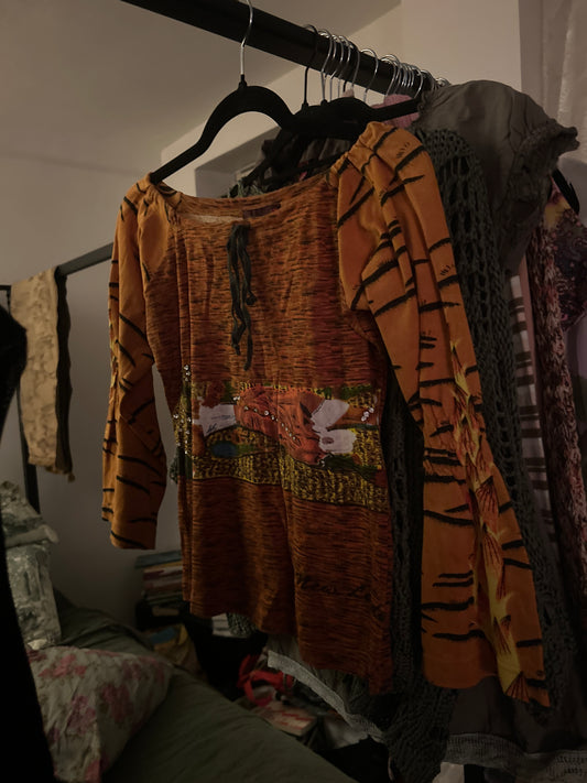 Orange graphic long sleeve top