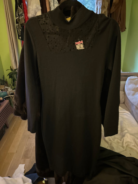 Black sweater dress with polka dot neckline