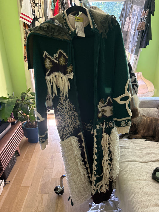 Green sweater with mountain scene