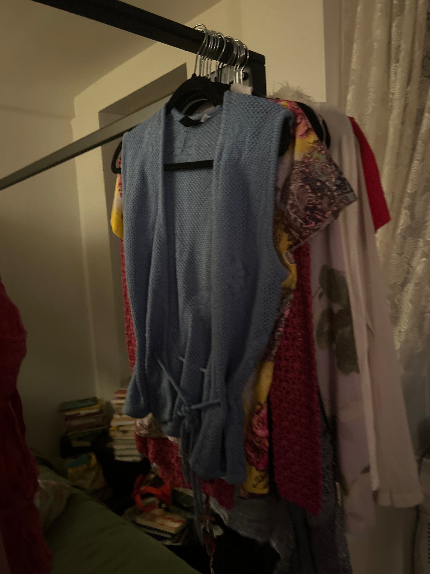 Sleeveless blue knit cardigan