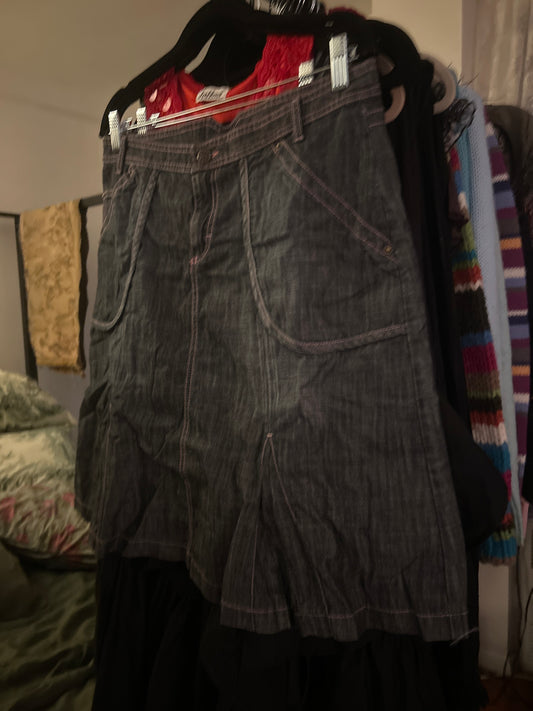 Dark denim skirt with pink stitching