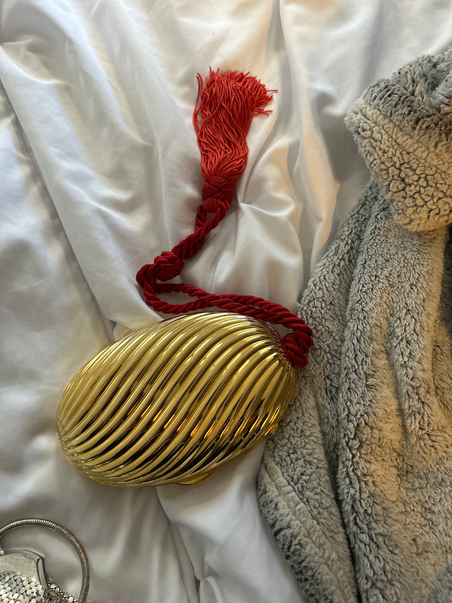 Gold purse with red cord