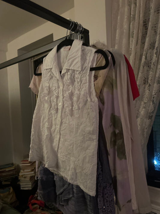 White sleeveless button up with tendrils