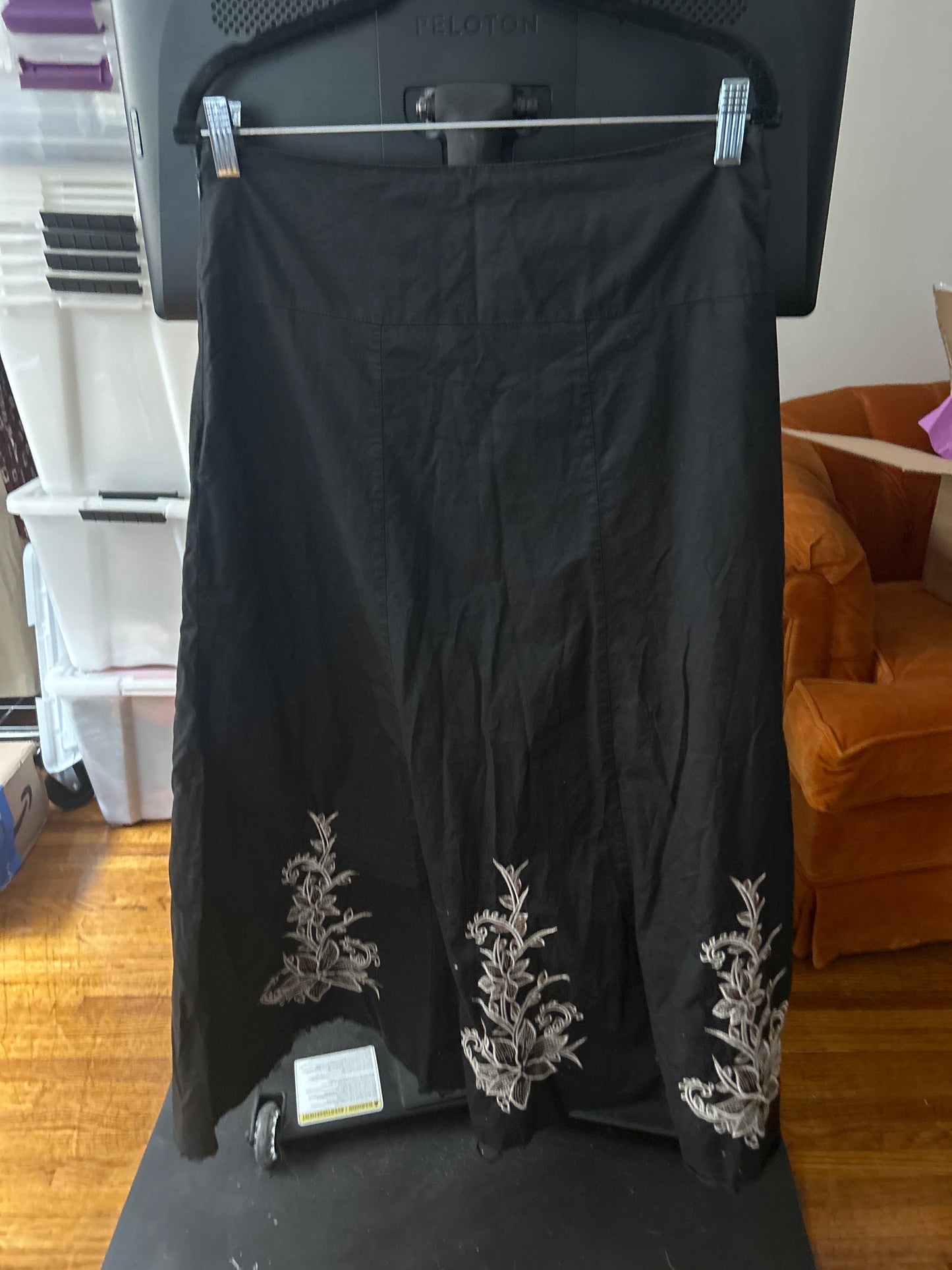 Black skirt white floral embroidery