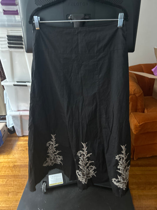 Black skirt white floral embroidery