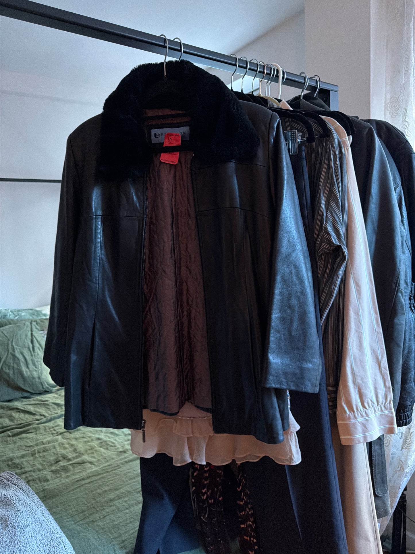 Black leather jacket with fur collar