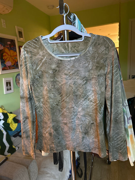 Green top with glitter/words