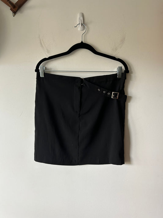 black mini skirt with buckle detail