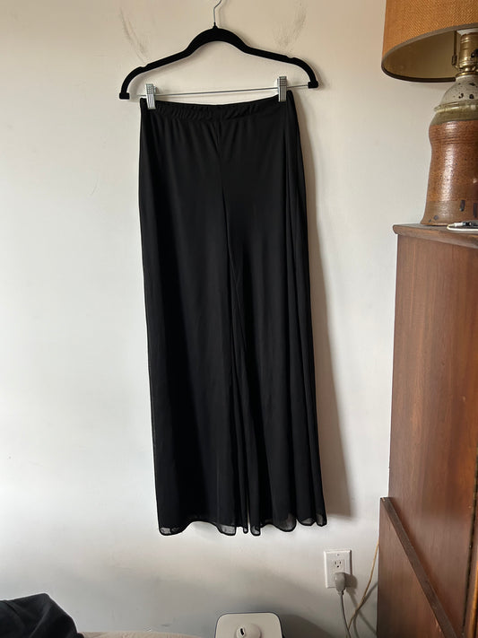 black trousers with sheer overlay